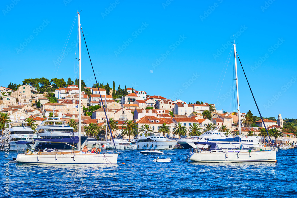 Luxury yachts and boats anchored in the harbor of Hvar, Croatia
