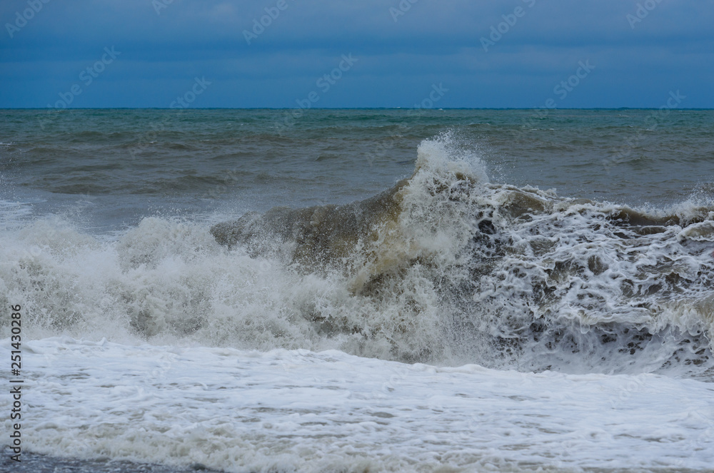 Stormy sea waves breaking near the coast Stormy sea waves breaking near the coast