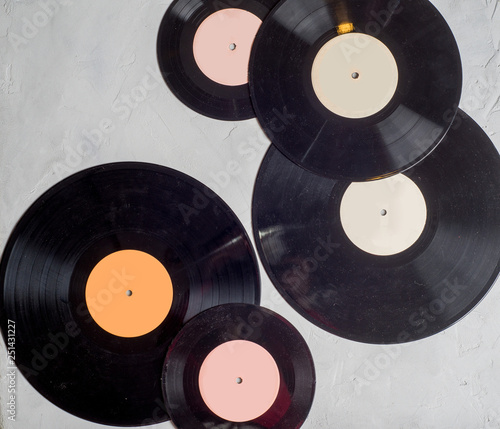 gramophone record of different sizes on a light background. View from above
