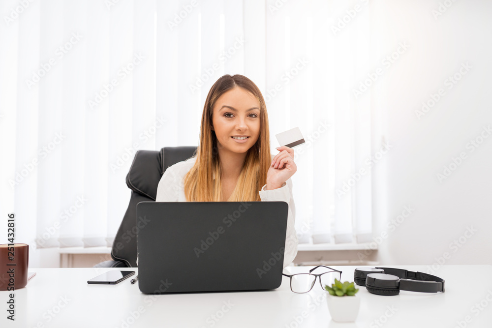 The adorable young manager is happy about buying online. The adorable young manager is happy about buying online.
