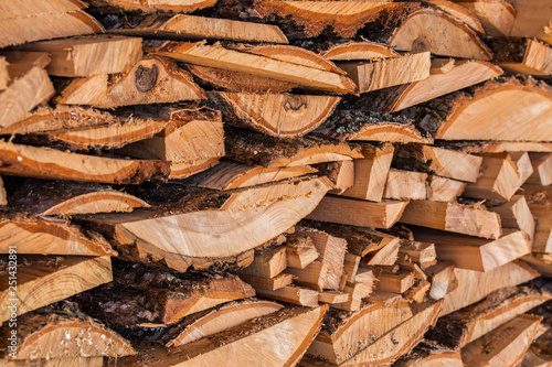 closeup background of firewood lumber leftovers stack with selective focus photo