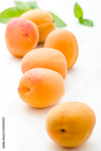 fresh apricots on white