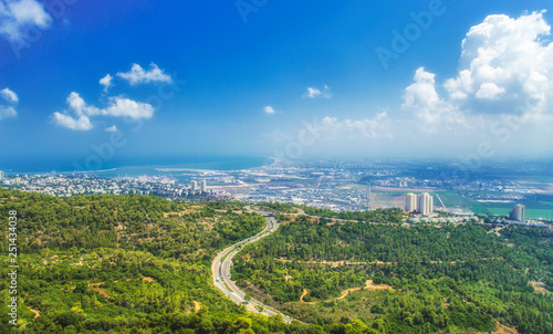 Panoramic view of the bay of Haifa  with downtown Haifa  the harbor  the industrial zone in a sunny summer day. Viewed from Haifa University. Haifa  Northern Israel