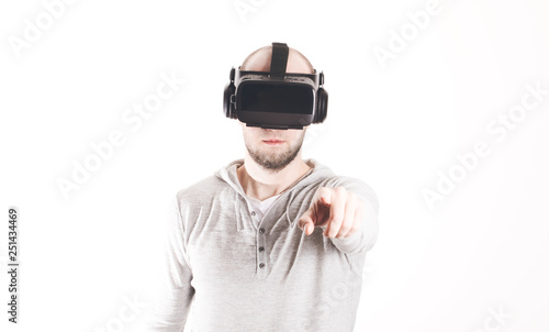 Man using virtual reality headset at white background © LALSSTOCK