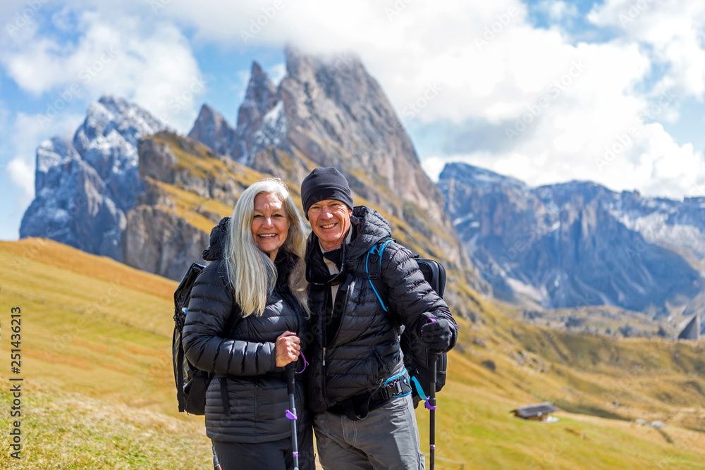 Couple hiking in the Dolomites, South Tyrol, Italy Couple hiking in the Dolomites, South Tyrol, Italy