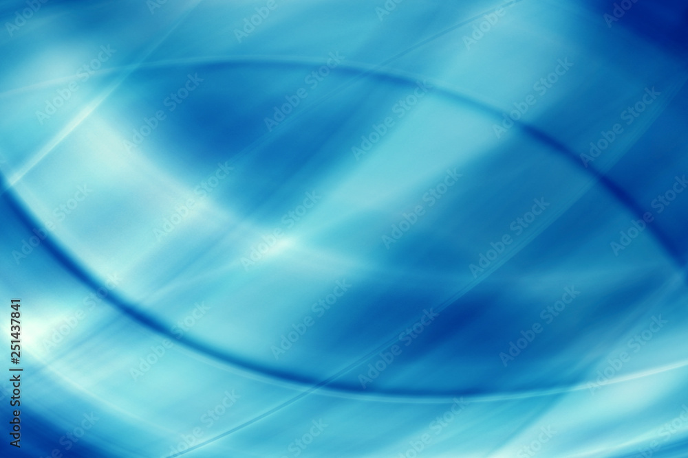 Naklejka premium Abstract beams of light rays on a blue background