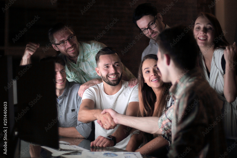 Fototapeta premium business colleagues shaking hands at the Desk