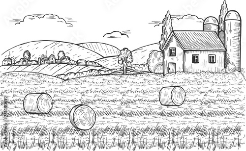Rural landscape with hay bale, farm and village below hills