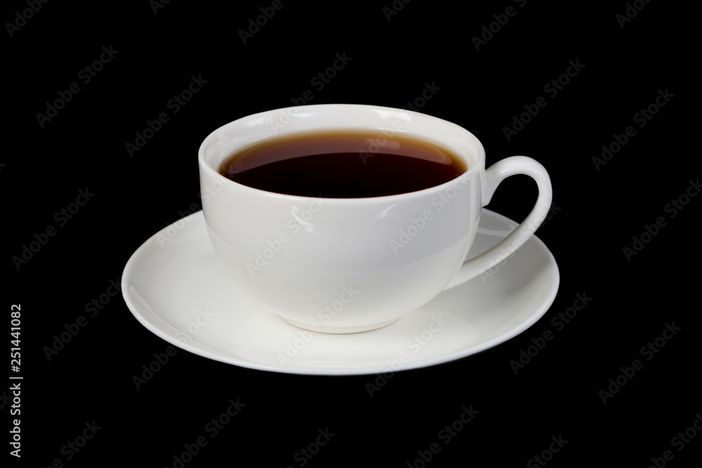 White cup with tea on a black isolated background White cup with tea on a black isolated background
