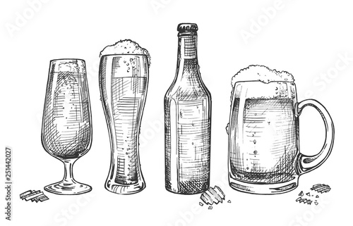 Set of isolated beer glasses and bottle