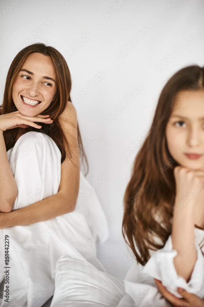relations between generations. mother and daughter love. white background