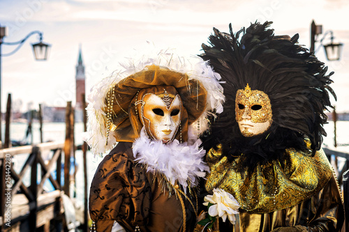 Close-up of a costume reveller poses during the Carnival in Venice, Italy. © 1tomm