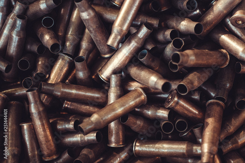 pile of used rifle cartridges 7.62 mm caliber, many empty bullet shells, assault rifle bullet shell, military background, top view