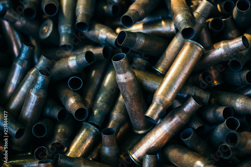 many empty bullet shells, pile of used rifle cartridges 7.62 mm caliber, assault rifle bullet shell, military background, top view