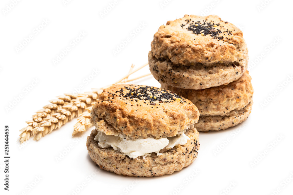 Wholemeal seeded scones stuffed with cream isolated on white Wholemeal seeded scones stuffed with cream isolated on white