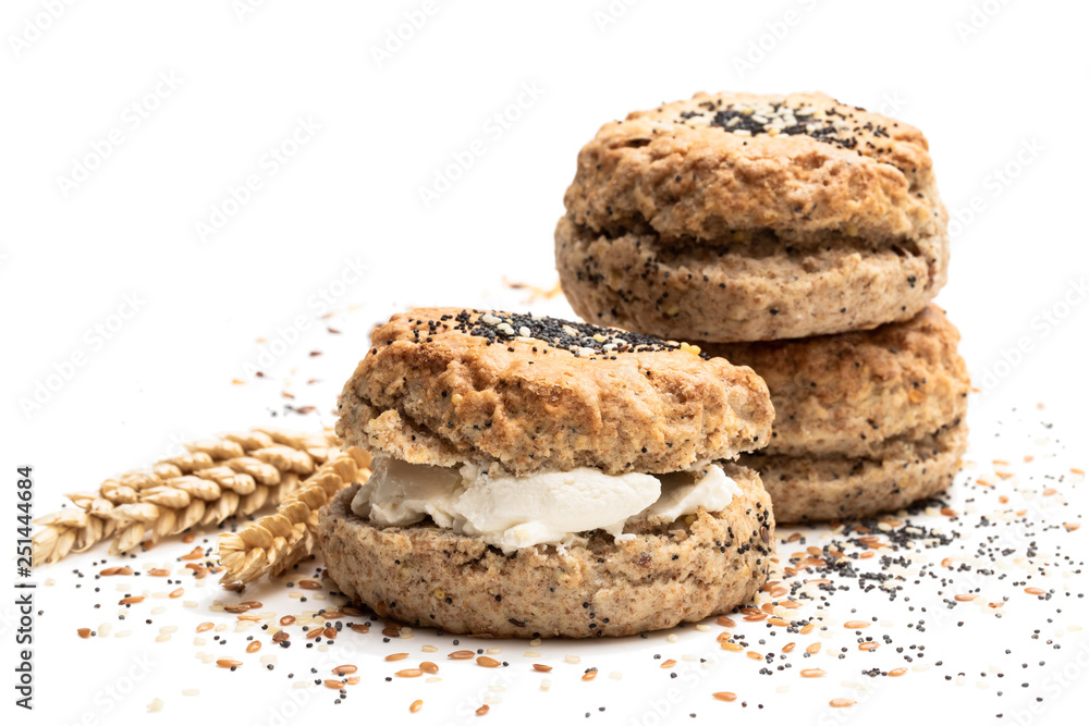Wholemeal seeded scones stuffed with cream isolated on white Wholemeal seeded scones stuffed with cream isolated on white
