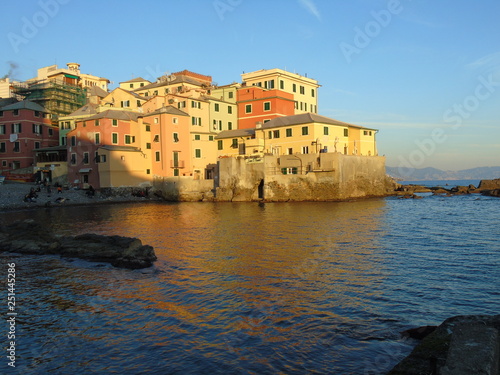 Genova  Italy - 02 14 2019  An amazing caption of the sunset over the sea and the city of Genoa in winter days and great views to the old buildings near the beach coloured by the sun