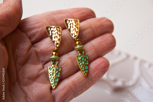 Metal gold turquoise earrings. Fashion luxury accessory jewellery.