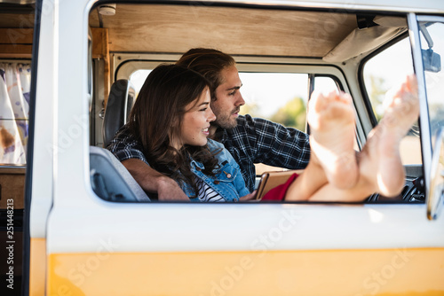 Affectionate couple doing a road trip in their camper photo