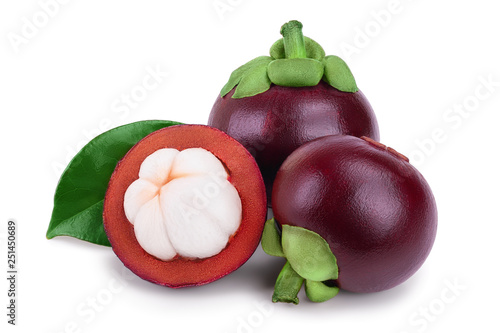 ripe mangosteen with leaves isolated on white background closeup photo