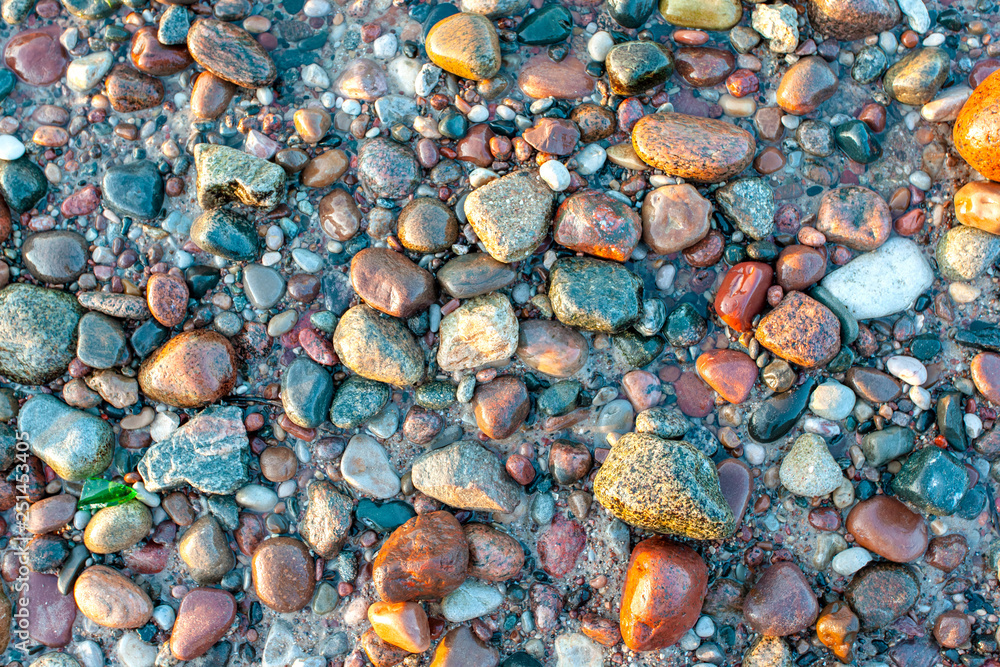surface of small colorful wet stones, background, texture surface of small colorful wet stones, background, texture