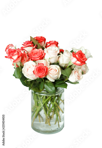 a bouquet of multi-colored roses in a glass vase isolated white background
