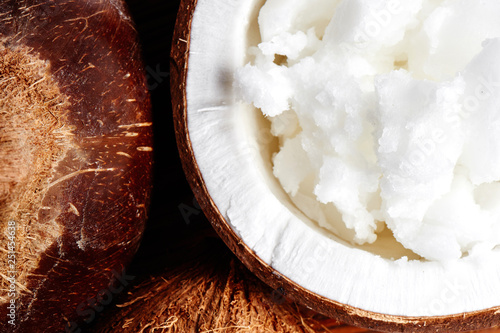 Vietnamese brown coconuts with coconut oil inside close up