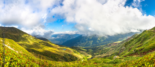  panorama mountain landscape with blue sky and white clouds © yanikap