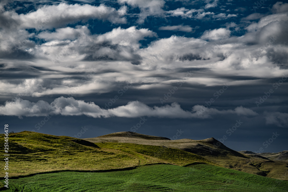 Iceland - entrance to Landmannalaugar - sunset view of clouds over summer hills Iceland - entrance to Landmannalaugar - sunset view of clouds over summer hills