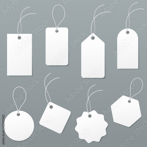 Set of empty white price tags in different shapes. Blank paper labels with string mockup isolated on grey background. luggage tag collection. Vector illustration.