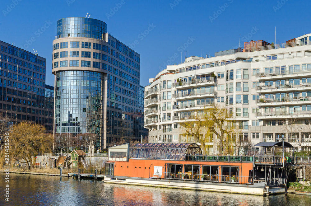 Banks of the river Spree, Spree-Bogen with the building of the former Bundesministerium and the restaurantship PATIO Banks of the river Spree, Spree-Bogen with the building of the former Bundesministerium and the restaurantship PATIO