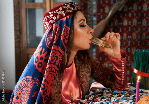 Beautiful azeri women and novruz tray with traditional pastry shekerbura and pakhlava photo