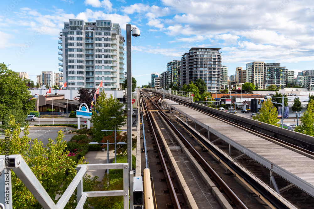 Fototapeta premium Elevated Rapid Transit System Tacks in a Urban Setting on a Summer Day. Vancouver, BC, Canada.
