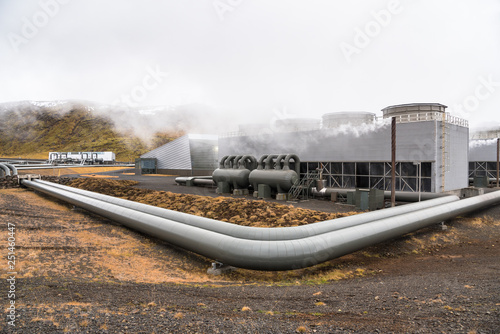 View of a Geothermal Power Plant with Big Steam Pipes on a Cloudy Day in Fall