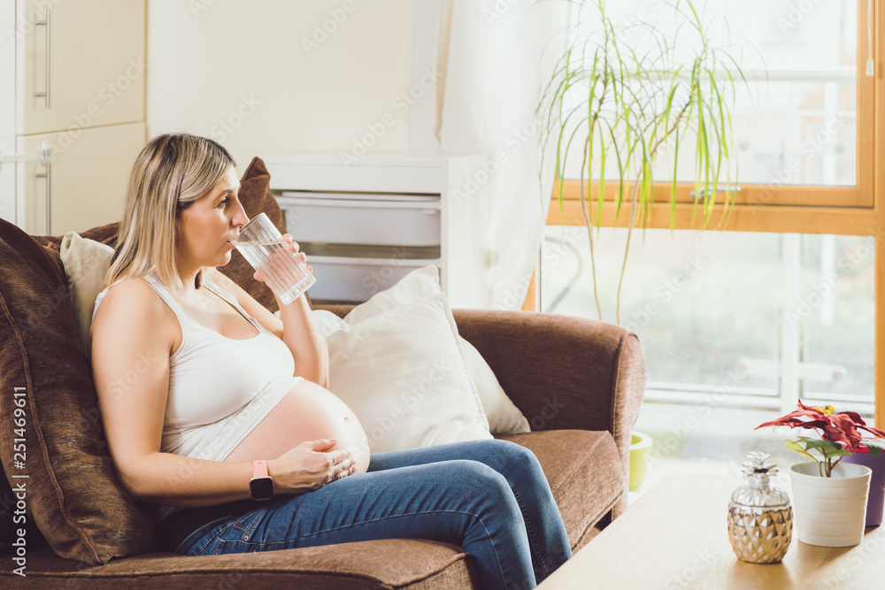 Mother mom daughter girl pregnant living room happiness
