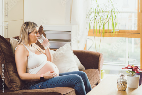 Mother mom daughter girl pregnant living room happiness