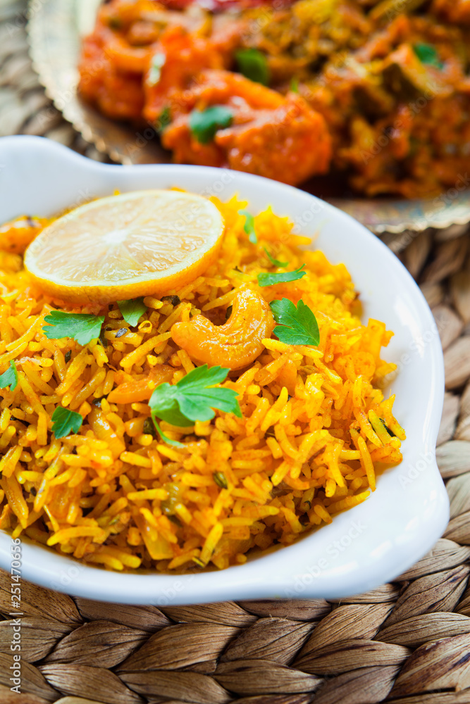 Indian Side dish Lemon Rice with Cashew Nuts and cilantro foto de