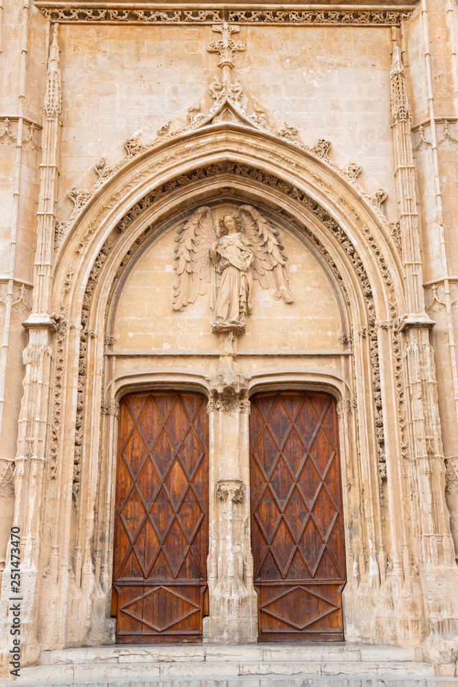 PALMA DE MALLORCA, SPAIN - JANUARY 29, 2019: The portal of La Lonja palace constructed by Guillem Sagrera (1420 - 1452) with the guardian angel statue.
