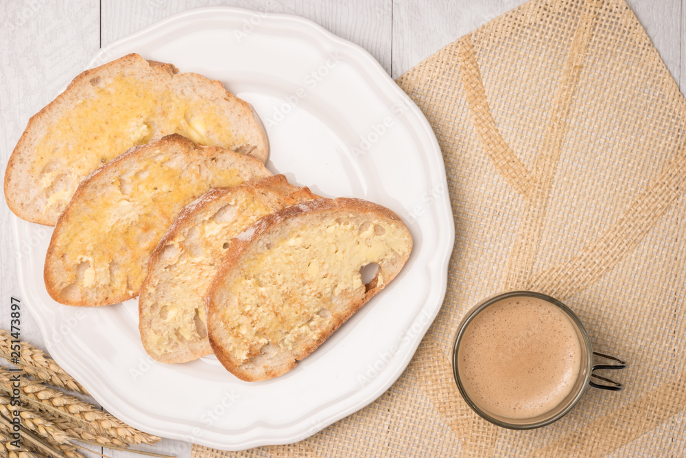 Fresh bread, homemade butter and coffee on wooden background. Fresh bread, homemade butter and coffee on wooden background.