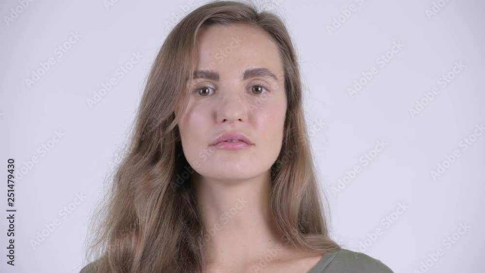 Face of young beautiful woman looking at camera Face of young beautiful woman looking at camera