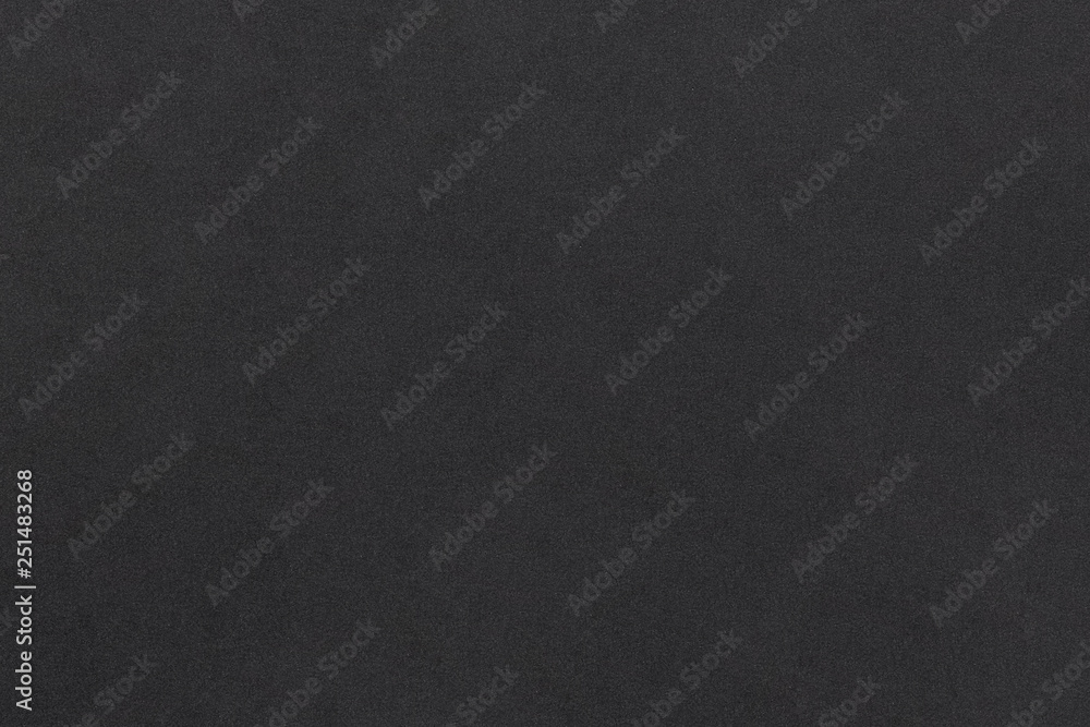 Black soft foam material matte surface with tiny grainy rough texture pattern abstract background design for presentation, banner, brochure wallpaper