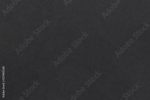 Black soft foam material matte surface with tiny grainy rough texture pattern abstract background design for presentation, banner, brochure wallpaper photo