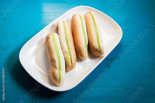 Green Custard bread Green cream cooking by banana leaf, Bread in breafast put on the white plate photo