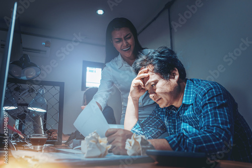 Obraz na plátně Serious woman boss scolding male employee for bad business result