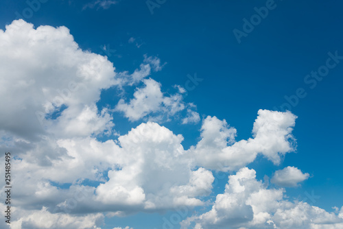 White clouds with blue sky background in sunny day. Green environmental and natural travel concept.