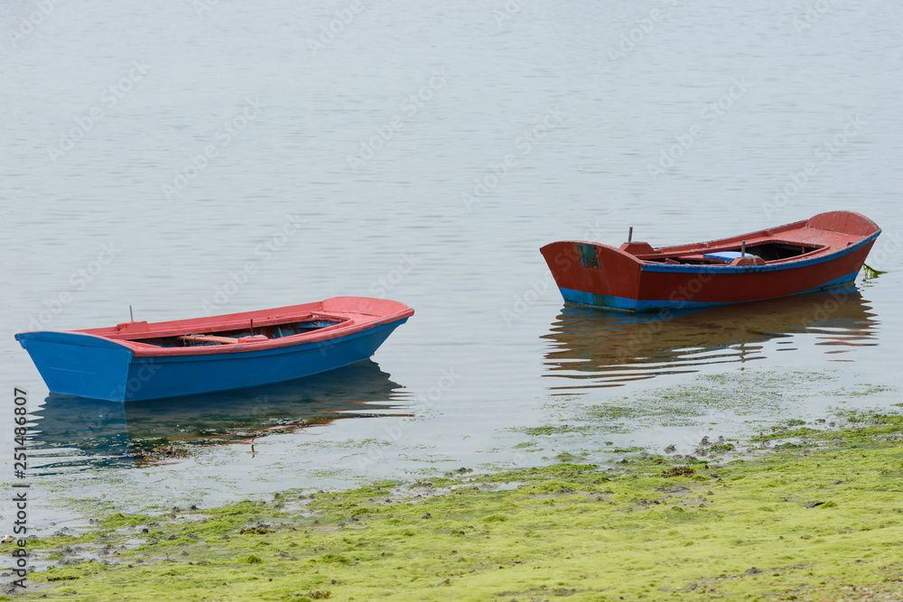 fishing wooden boat moored in the sea fishing wooden boat moored in the sea