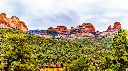Rain clouds hanging over the red rocks of Schnebly Hill and other red rocks at the Oak Creek Canyon viewed from Midgely Bridge on Arizona SR89A, between Sedona and Flagstaff in northern Arizona, USA photo