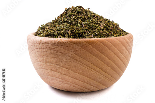 thyme herb in wooden bowl isolated on white background.