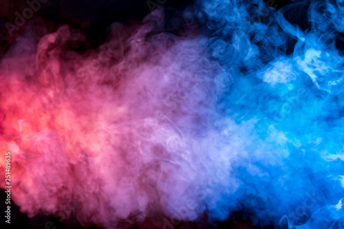 Beautiful horizontal column of smoke in the neon bright light of blue pink and orange on a black background exhaled out of the vape  mocap and print for t-shirt.
