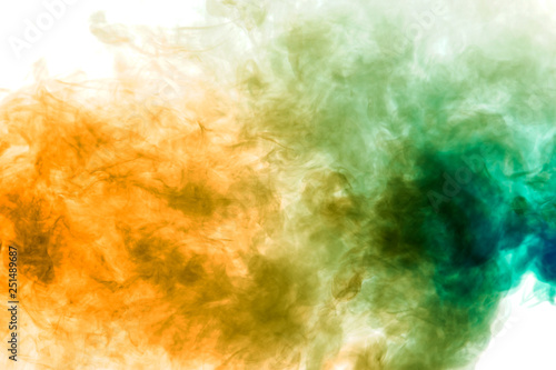 Fototapeta Naklejka Na Ścianę i Meble -  Colorful steam exhaled from the vape with a smooth transition of color molecules from yellow to blue on a white background like a collision of two jets of smoke.